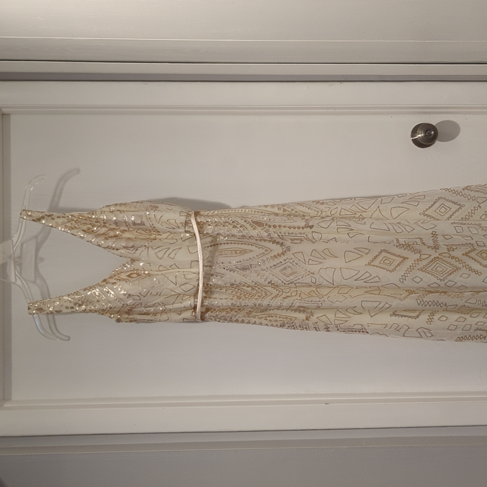 Angelina Faccenda. Cream/ Gold sequin design.